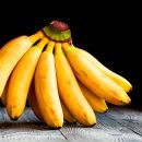 Bunch of bananas on wooden background Close-up Bunch of bananas on grunge wooden background